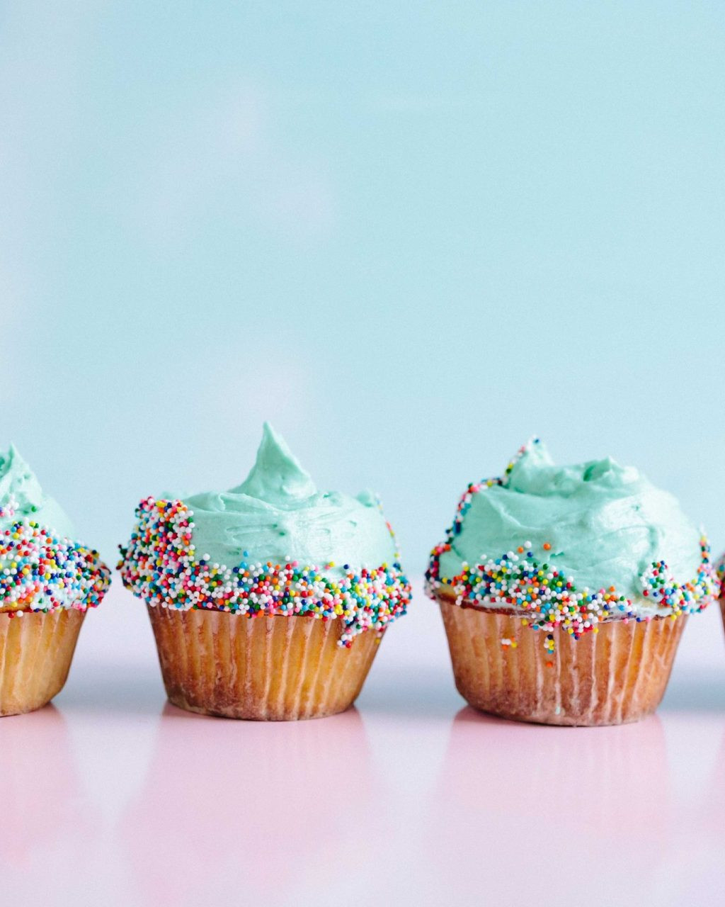 Cupcakes Lined Up on a Table