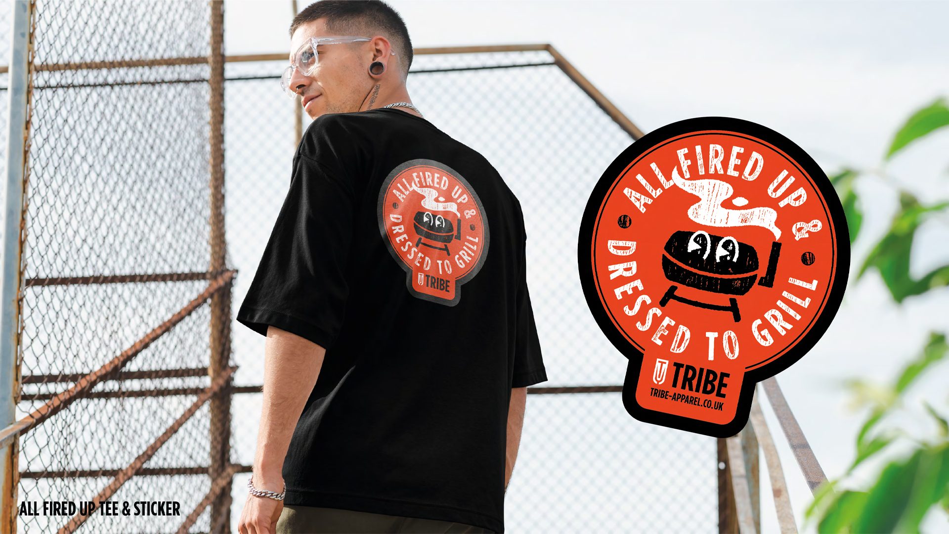 High-quality image of a black t-shirt with a large Tribe graphic on the back.