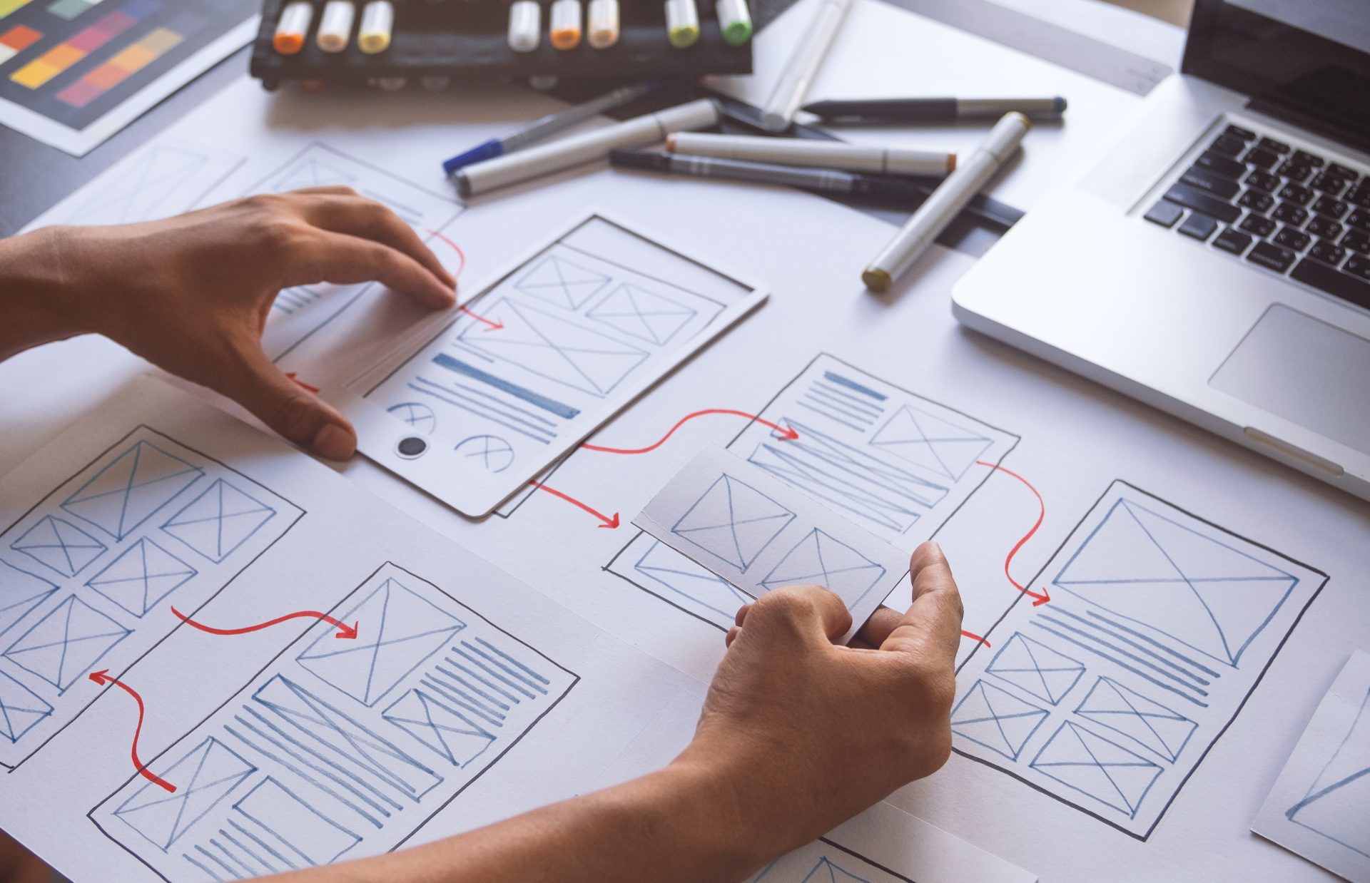 Graphic showing a UX designer’s sketches and wireframes illustrating application development and prototype planning.