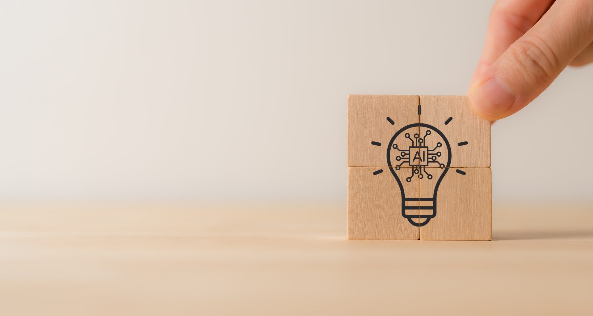 Four stacked blocks forming a square with a lightbulb illustration and “AI” in the center
