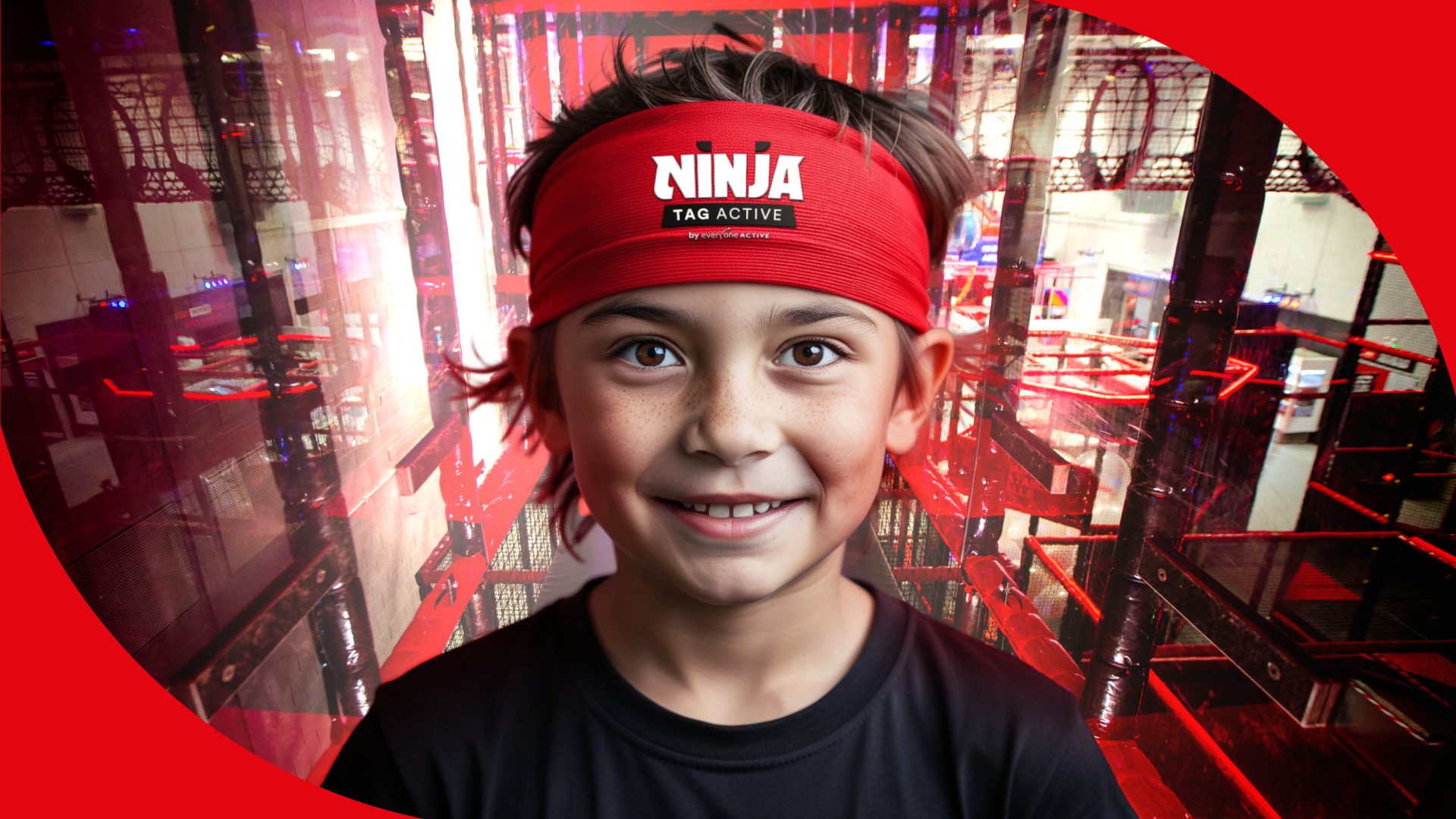 Young boy wearing a red Ninja Active Tag headband standing in front of the Ninja Active Tag course.