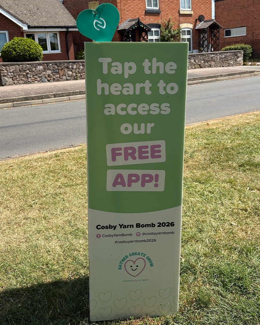 Sign promoting the free Cosby Yarn Bomb app